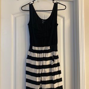 Black top with black and cream striped bottom dress.
